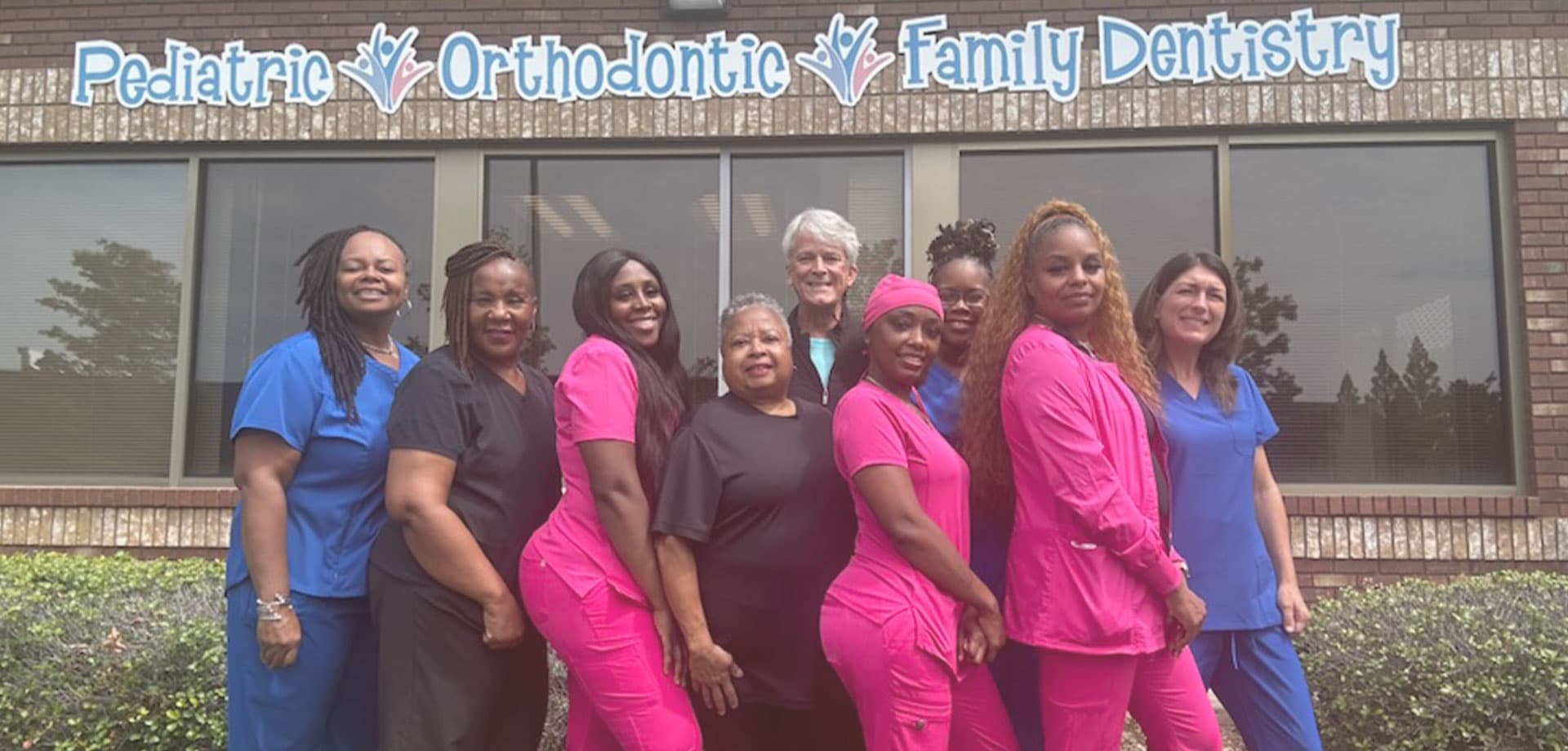 The Lithonia Pediatric Dentistry team in front of the Stonecrest office